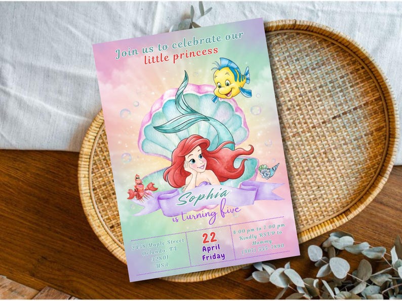 May include: A colorful invitation featuring a mermaid, a seashell, and a yellow fish. The invitation reads "Join us to celebrate our little princess" and "Sophia is turning five." Additional text includes the date, time, and location.