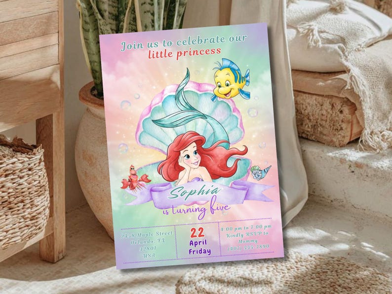 May include: A colorful invitation for a little princess's fifth birthday, featuring Ariel from The Little Mermaid. The design includes a mermaid, a seashell, and the text "Join us to celebrate our little princess". The invitation also includes the name "Sophia" and the date.