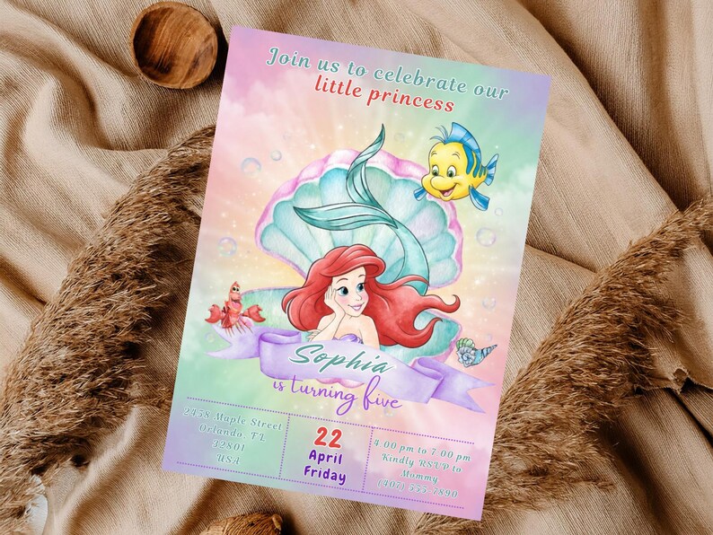 May include: A colorful invitation card featuring a mermaid, a fish, and a seashell. The text "Join us to celebrate our little princess" is at the top. The invitation is for Sophia's fifth birthday, with the date April 22nd.