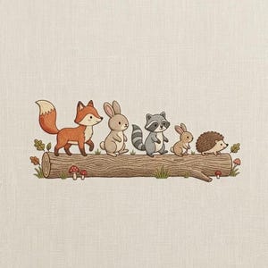 May include: An embroidered illustration on light fabric featuring a fox, a rabbit, a raccoon, a smaller rabbit, and a hedgehog standing in a line on a brown log. Small red mushrooms and green leaves are positioned around the base of the log.