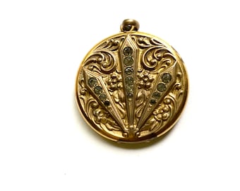 Vintage gold tone metal locket with rhinestones