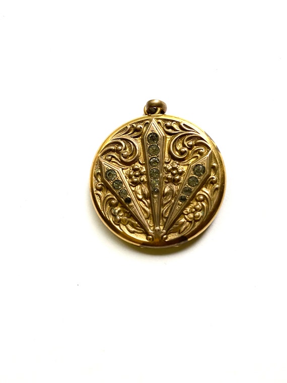 Vintage gold tone metal locket with rhinestones