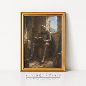 May include: A framed wall art print depicting a knight in full metal armor sitting on a wooden barrel while reading an open book. The scene is set within a stone room with a blue banner on the wall and a view of a landscape through an open window.