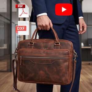 May include: A brown leather briefcase featuring two top handles, a detachable shoulder strap with brass-toned metal hardware, and a front zippered pocket. The bag includes digital file icons for PDF and DXF formats and a red YouTube play button icon.