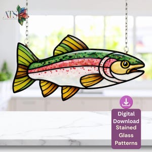 May include: A colourful stained glass rainbow trout, hanging from chains. The fish is depicted with green, yellow, red, and white hues. The image includes the text "Digital Download Stained Glass Patterns."