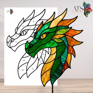 May include: A stained glass dragon head in shades of green, yellow, and orange, with a black metal stake. A black and white line drawing of the dragon head is on a white background. The image includes the text "ATS GLASS PATTERN".