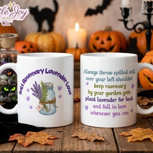 May include: A white ceramic mug featuring a graphic of a glass jar filled with lavender and rosemary, with the text Salt Rosemary Lavender Love. The reverse side displays the text Always throw spilled salt over your left shoulder keep rosemary by your garden gate plant lavender for luck and fall in love whenever you can.