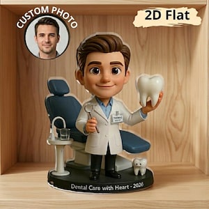 May include: A figurine of a cartoon dentist holding a tooth and dental tool, wearing a white coat. The figurine is in front of a dental chair and a small tooth figurine. The base reads "Dental Care with Heart - 2026".