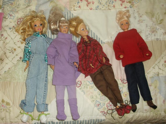 four barbie doll