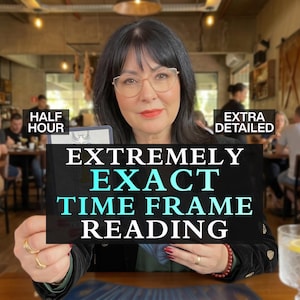 May include: A person with dark hair and glasses holds a tarot card. Text overlays read: HALF HOUR, EXTRA DETAILED, EXTREMELY EXACT TIME FRAME READING. The person wears a dark jacket with gold accents and rings on their fingers, with a red bracelet.