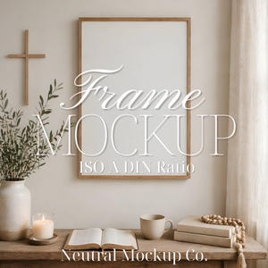 May include: A wooden framed mockup with the text "Frame Mockup ISO A DIN Ratio". A wooden cross hangs on the wall. A vase with greenery, a candle, a book, a mug, and a stack of books are on a wooden table. The text "Neutral Mockup Co." is at the bottom.