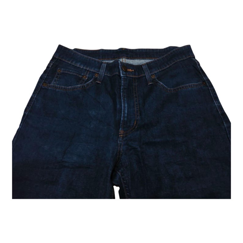 May include: Dark blue denim jeans with a classic five-pocket design. The jeans have a button and zipper closure, with visible stitching and rivets. The fabric appears to be a medium-weight denim.