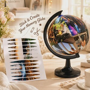 May include: A black globe stand with a spherical map featuring custom photo collage segments. Beside it, a white sheet displays pre-cut, elongated photo strips with the text Stick & Create Your Memory Globe, accompanied by icons of a glue stick and scissors.