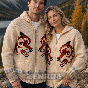 May include: Cream-coloured zip-up sweater with a red and black dragon design. The sweater has a shawl collar, pockets, and blue and grey patterned accents. The logo "ZENROS" is visible in the upper left corner.