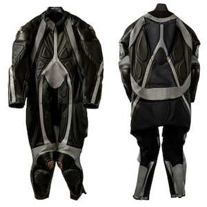 May include: Black and gray motorcycle racing suit. The suit is made of leather and features padded sections on the shoulders, elbows, chest, and knees. Silver stripes run along the sides and back of the suit.