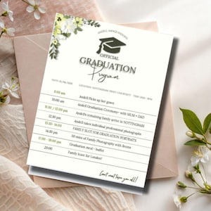 May include: A graduation program with a floral design, featuring a schedule of events. The program is on a white background with a graduation cap graphic. The program includes the text "OFFICIAL GRADUATION Program".