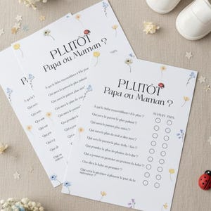 Peut inclure: Feuilles de jeu blanches avec le texte "PLUTÔT Papa ou Maman ?" décorées d'illustrations florales. Les feuilles de jeu sont pour une baby shower. Une coccinelle et des chaussures de bébé sont également dans l'image.