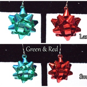 May include: Two pairs of bow earrings, one pair in green and one pair in red. The top pair is labeled "Large" and the bottom pair is labeled "Small" and "Green & Red".