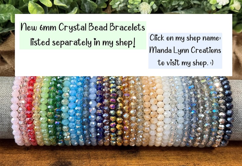 May include: A collection of 6mm crystal bead bracelets in a spectrum of colors including pink, red, green, blue, purple, gold, and black. The text reads: New 6mm Crystal Bead Bracelets listed separately in my shop! Click on my shop name: Manda Lynn Creations to visit my shop. :)