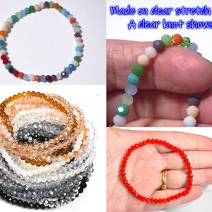 May include: A collection of stretch bracelets made from small, faceted, multi-colored glass beads. The bracelets are strung on clear stretch cord with a visible knot. The beads come in various solid colors including red, orange, blue, and clear.