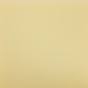 May include: A solid, pale yellow background.