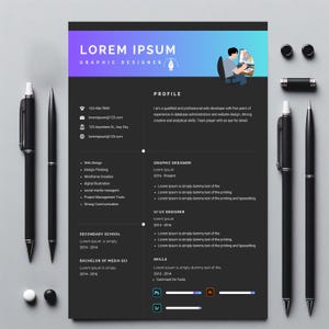 May include: A graphic designer's CV template in black and grey. The document includes sections for profile, skills, and experience. The text "LOREM IPSUM GRAPHIC DESIGNER" is at the top. Several black pens and small black objects surround the CV.