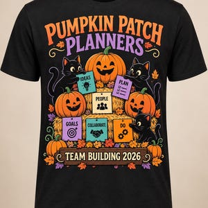May include: A black t-shirt featuring a graphic of three black cats and three jack-o'-lanterns. The text reads PUMPKIN PATCH PLANNERS and TEAM BUILDING 2026. Six colorful squares display the words IDEAS, PLAN, PEOPLE, GOALS, COLLABORATE, and DO.