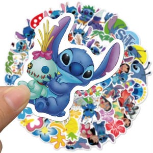 May include: A collection of colourful stickers featuring the character Stitch from the Disney film Lilo & Stitch. The stickers include various images of Stitch, some holding a doll, and other tropical designs.