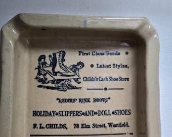 Vintage ceramic F.L. Childs First Class Goods Holiday Slippers & Doll Shoes Westfield Massachusetts advertising ashtray