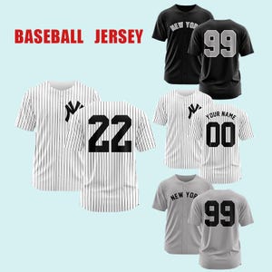 May include: A collection of short-sleeved baseball jerseys in black, white with pinstripes, and gray. The jerseys feature button-front closures, team-style lettering, and large back numbers including 22, 99, and 00. The text BASEBALL JERSEY is visible.