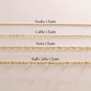 May include: Four gold-coloured chain styles are displayed: Snake Chain, Cable Chain, Twist Chain, and Ball Cable Chain. The names of each chain style are printed in black text above each chain. The chains are displayed on a light-coloured background.