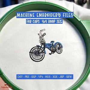 May include: Machine embroidery design of a blue bicycle with high handlebars, centered in a green embroidery hoop on white fabric. Text reads: MACHINE EMBROIDERY FILES FOR CAPS 4x4 HOOP SIZE and DST - PES - EXP - VP3 - HUS - XXX - JEF - SEW.