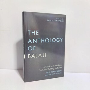 May include: A dark gray hardcover book titled The Anthology of Balaji, featuring white and light blue text. The cover includes the subtitle A Guide to Technology, Truth, and Building the Future, with an introduction by Balaji Srinivasan.