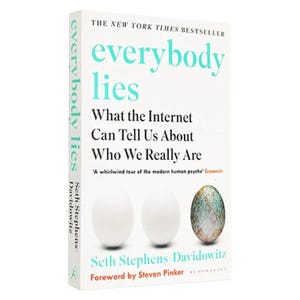 May include: A white book titled Everybody Lies: What the Internet Can Tell Us About Who We Really Are by Seth Stephens-Davidowitz. The cover features two plain white eggs and one speckled, multicolored egg, with a quote from The Economist.