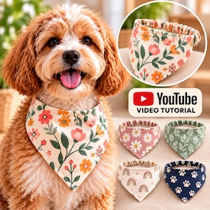 May include: A dog wearing a cream-colored bandana with a floral pattern featuring pink, orange, and green botanical elements. Four additional bandanas are displayed, showcasing daisy, leaf, rainbow, and paw print patterns with elastic bands.