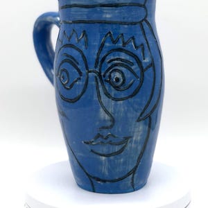 Hand-Carved Portrait Mug: Whimsical Blue Stoneware Coffee Cup