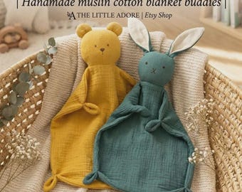 May include: Two muslin cotton loveies, one mustard yellow bear and one teal rabbit, featuring knotted corners and embroidered facial details. Text reads: SNUGGLE-SOFT LOVEIES | Handmade muslin cotton blanket buddies | THE LITTLE ADORE | Etsy Shop.