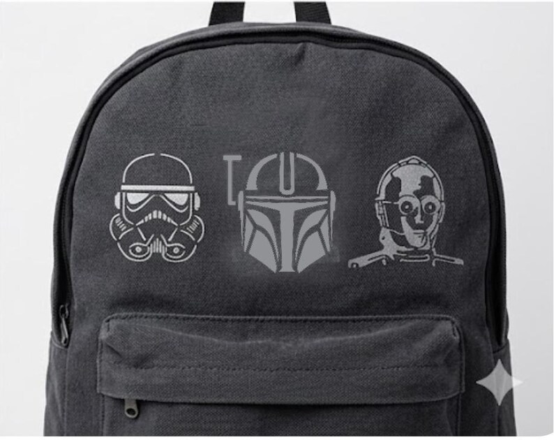 May include: A dark gray backpack featuring three Star Wars character designs in white: a Stormtrooper helmet, the Mandalorian helmet, and C-3PO. The word "I" is between the Stormtrooper and Mandalorian designs. The backpack has a front pocket and a top handle.