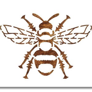 May include: A detailed, brown bee illustration with intricate wing patterns and body segments. The bee is centered on a white background, showcasing the insect's form and texture. The design has a wood-grain appearance.
