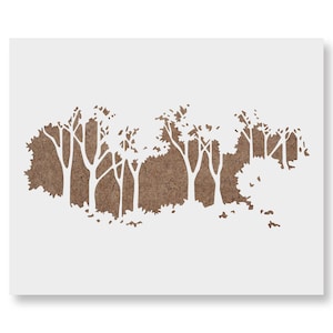 May include: A white stencil featuring a forest scene with trees and foliage. The trees are cut out, revealing a brown background. The design is suitable for various craft projects and home decor.