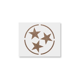 May include: A stencil featuring the Tennessee state flag emblem. The design includes three five-pointed stars within a circle, all in a brown color, set against a white background. The stencil is likely for crafts or decorative purposes.