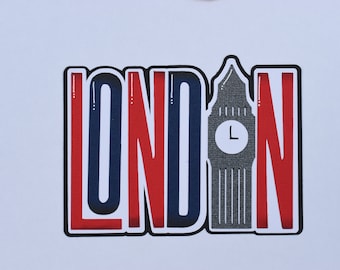 Op de afbeelding: Decoratief bord met het woord "LONDON" in rood, wit en blauw, met een zwarte omtrek. De "O" is vervangen door een grijze illustratie van de Big Ben.