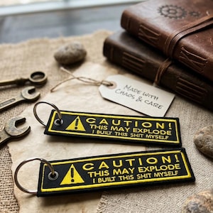 CAUTION! This may explode.." Flight Tag Keychain