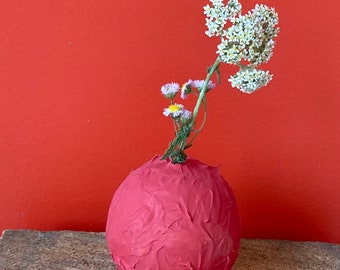 Textured red bud vase.