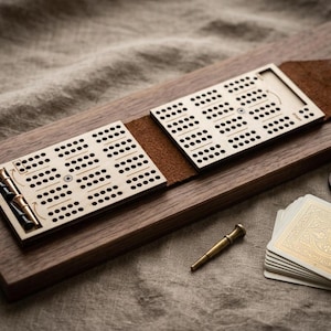 May include: A trio of ceramic mugs with a speckled, matte finish in cream, light grey, and dark grey. Each mug features a minimalist design and a rounded handle.