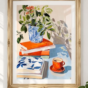May include: A framed painting depicting a blue and white patterned vase filled with green foliage and red berries, resting on a stack of orange and white books. Beside the books sits an orange teacup and saucer on a light blue surface.
