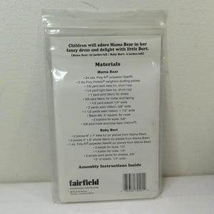 May include: A clear plastic package containing a sewing pattern for Mama Bear and Baby Bert stuffed animals. The pattern includes a list of materials such as fabric, fiberfill, and ribbon, with assembly instructions.