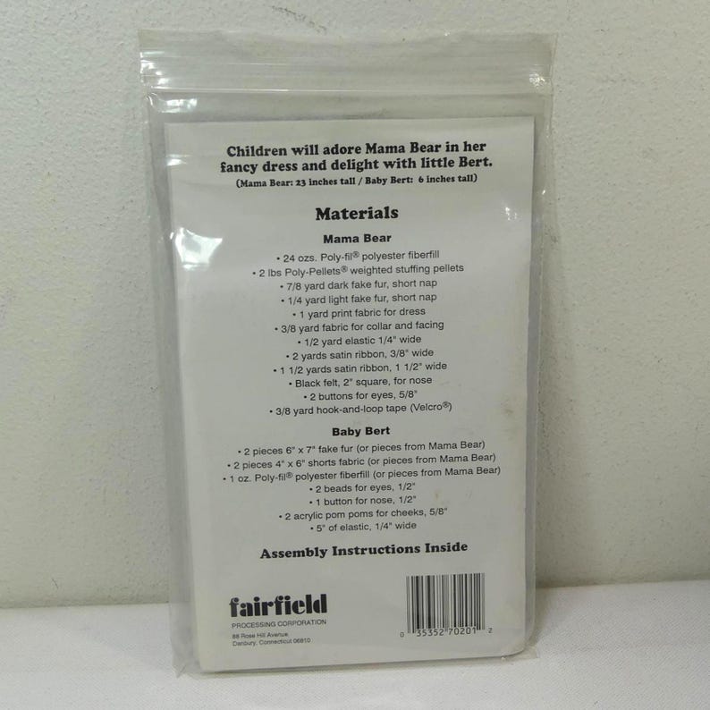 May include: A clear plastic package containing a sewing pattern for Mama Bear and Baby Bert stuffed animals. The pattern includes a list of materials such as fabric, fiberfill, and ribbon, with assembly instructions.