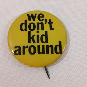 May include: A yellow button with black text that reads "We don't kid around".