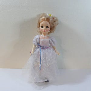 1975 Effanbee Jointed Plastic Doll #1176 with Blonde Hair & Sleepy Eyes in White Dress with Stand